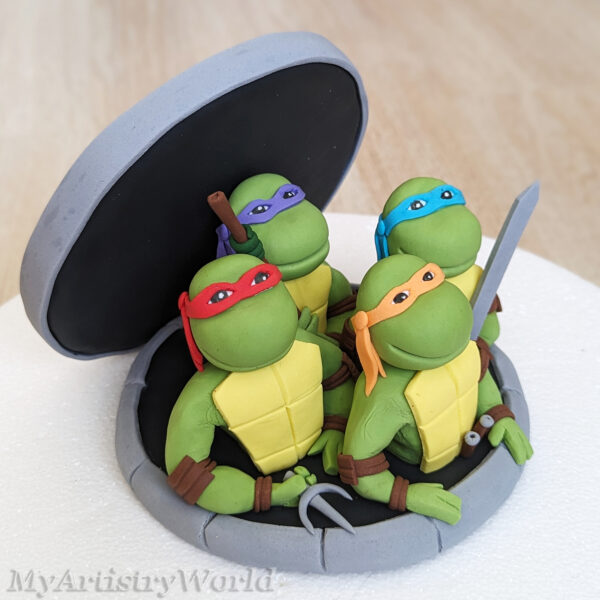 Ninja Turtles coming out of Sewer cake topper