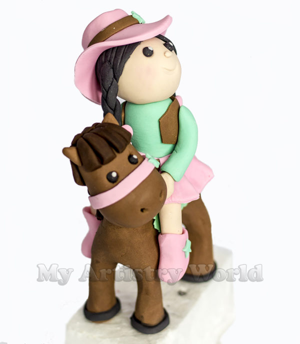 Sheriff Girl on a horse cake topper